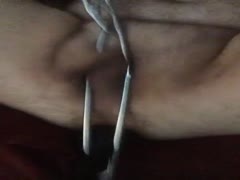 Nasty dude putting metal chains in his dick